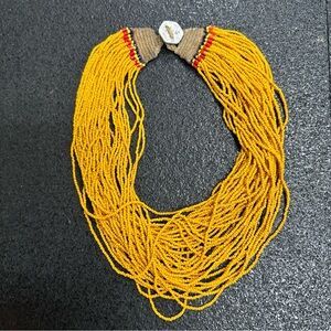authentic Konyak Naga multi-strand yellow glass bead necklace with a coin clasp